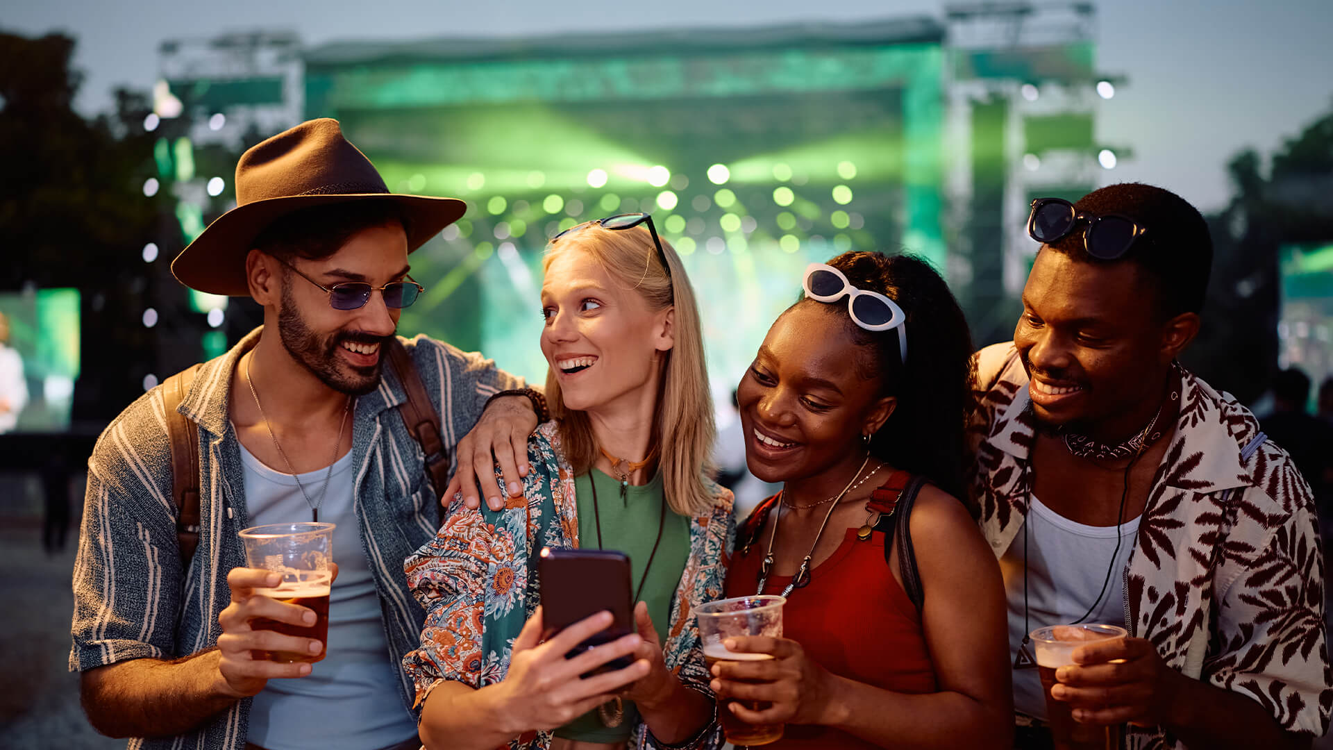 Friends sharing a mobile experience together at a live event