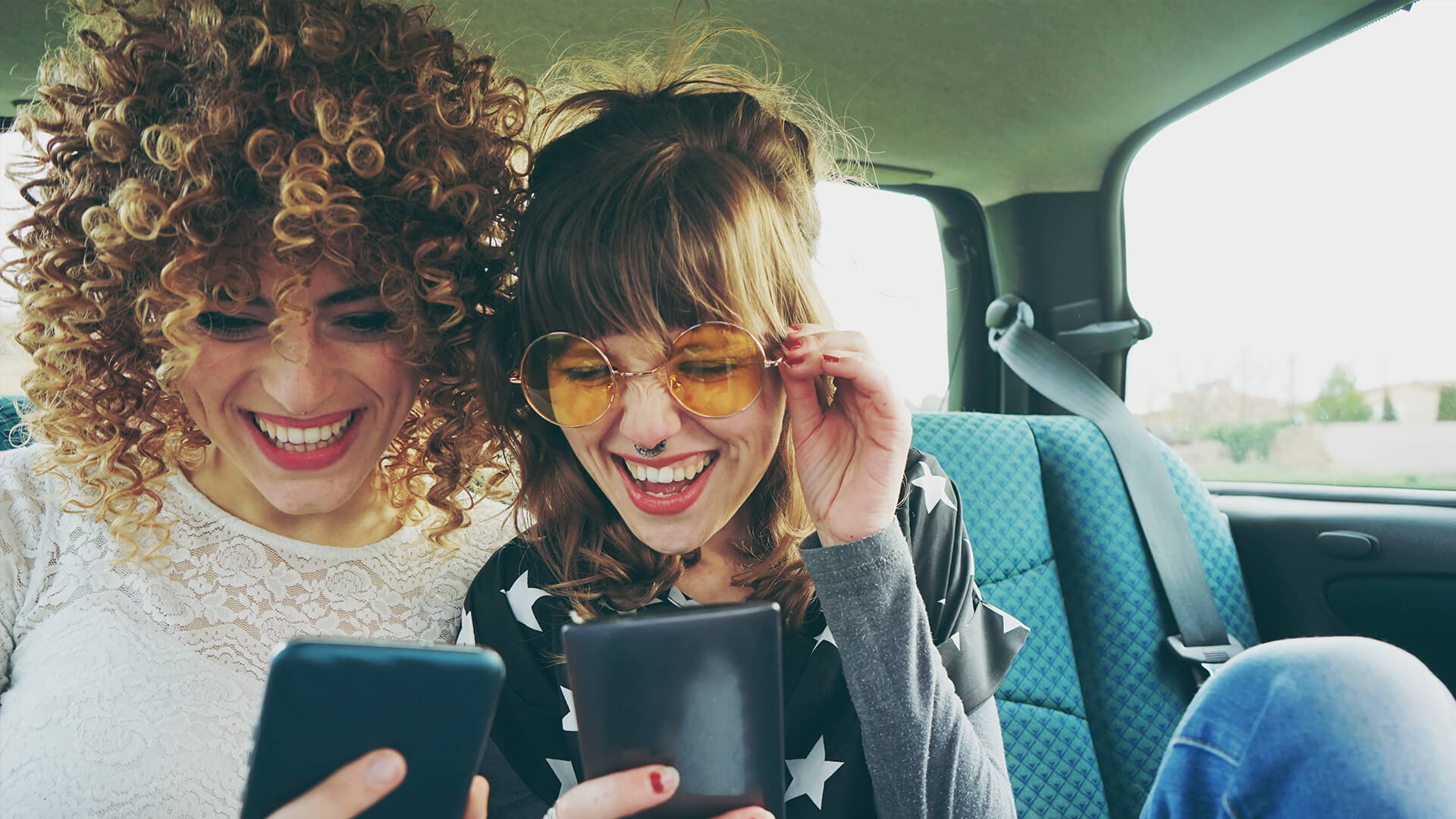 Friends sharing a mobile experience together at a live event